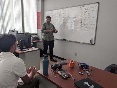 Students brainstorming at a whiteboard