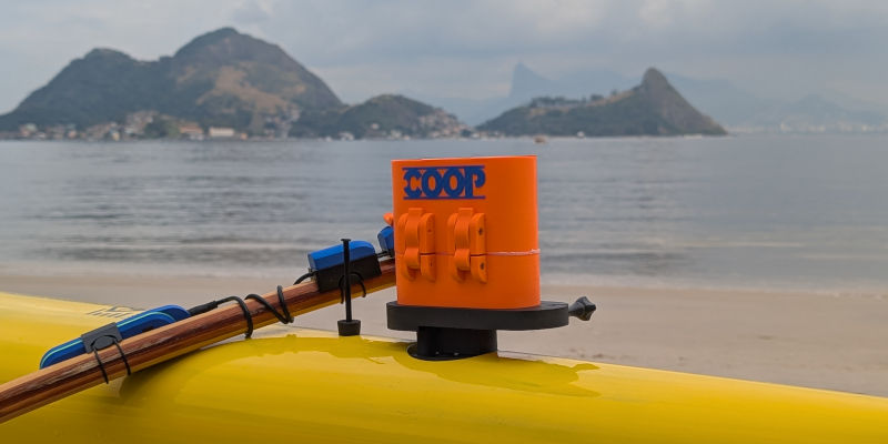 Cooperative Outrigger Paddling system attached to a canoe
